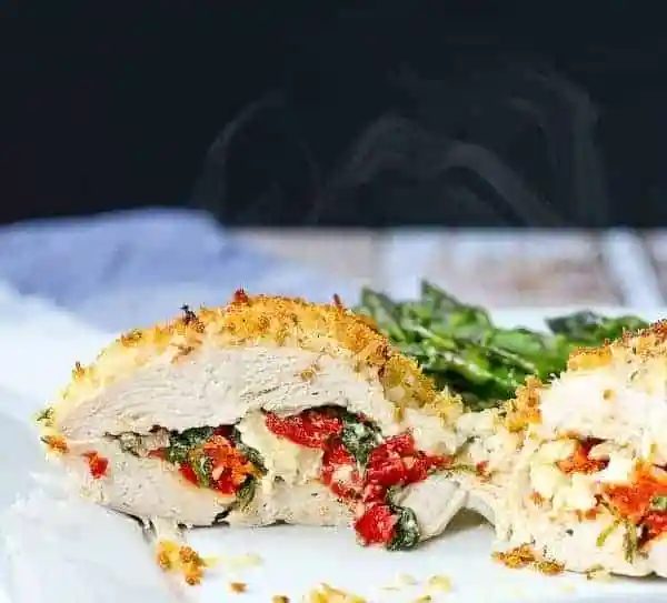 Feta Stuffed Chicken Breasts, served with Sun-Dried Tomato and Kale