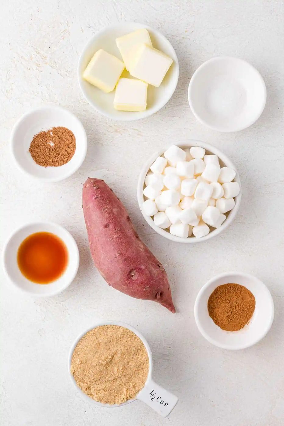 Overhead view of ingredients needed for recipe, only one sweet potato pictured.