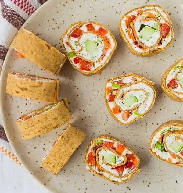 Sliced vegetable cream cheese roll ups.