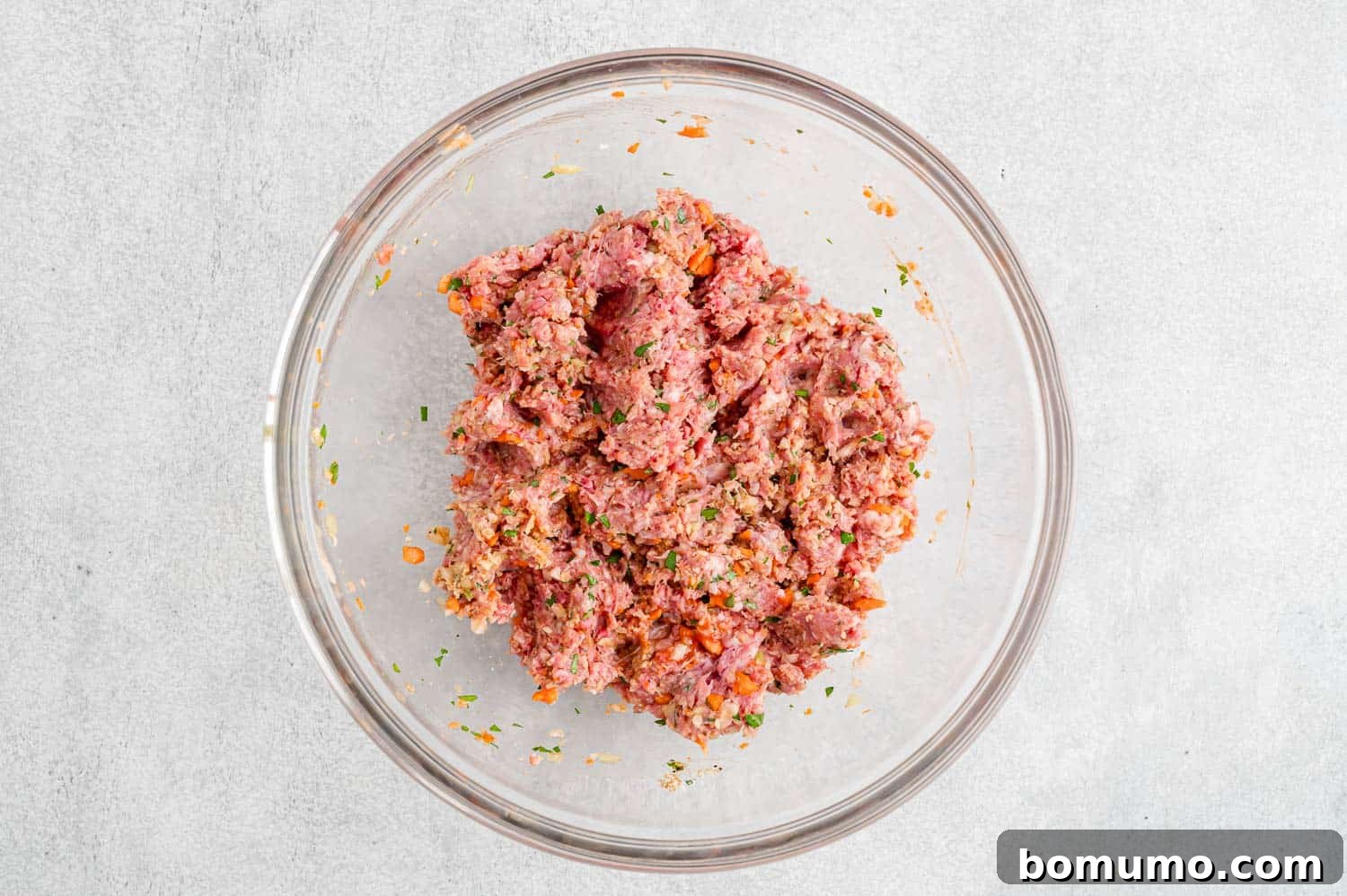 The fully blended meatloaf mixture in a mixing bowl, ready to be shaped.