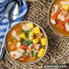 Jerk chicken chili topped with fresh mango salsa.
