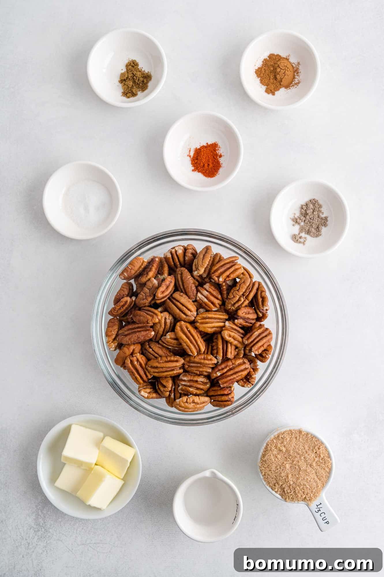 Best Spiced Pecans Ever 4 Ingredients in separate dishes. Ready to be transformed into spiced pecans.