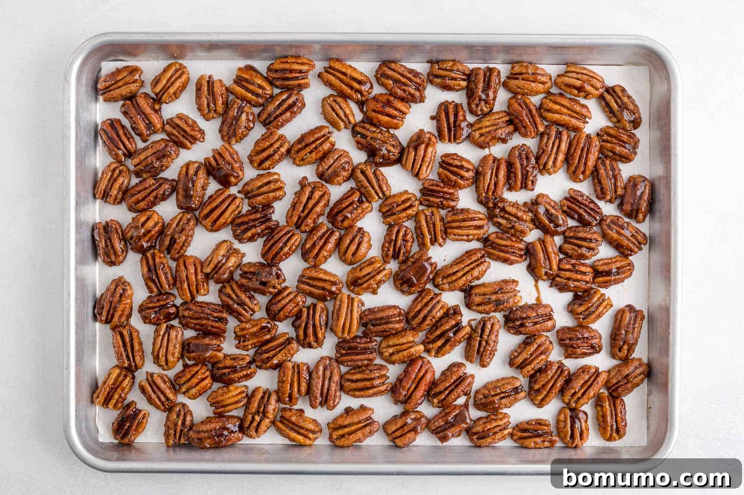 Best Spiced Pecans Ever 9 Spiced pecans on a sheet pan, ready to cool and harden.