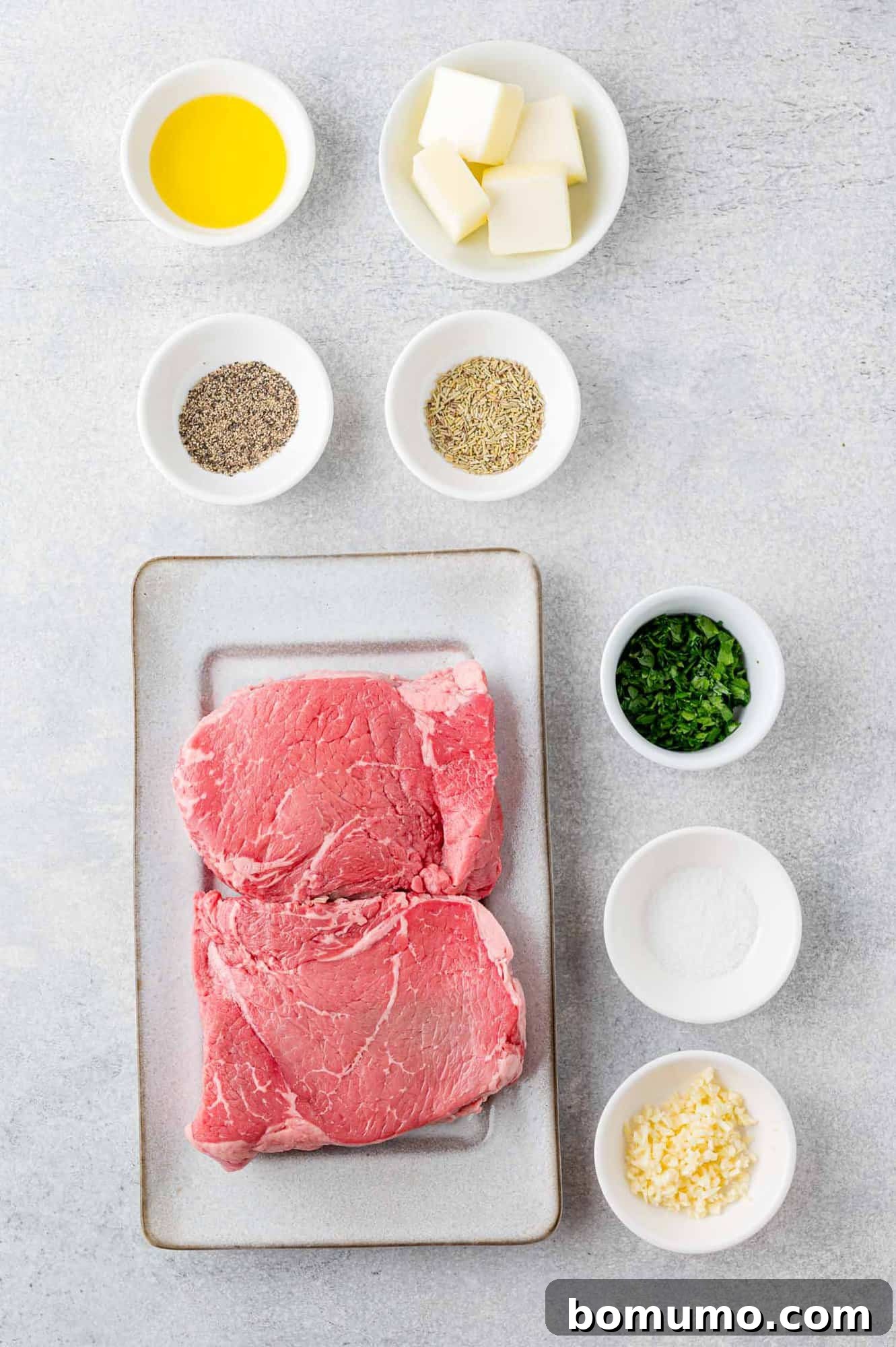An overhead view showcasing all the fresh ingredients needed for this delicious steak bite recipe, including raw steak.