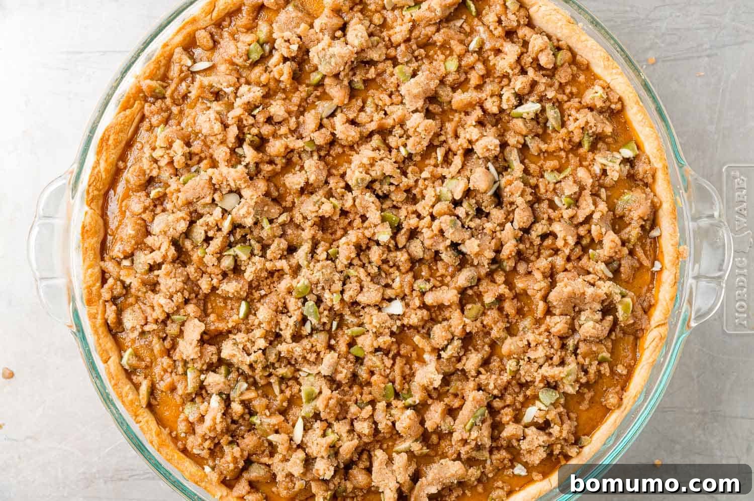 Streusel added to pie midway through baking time.