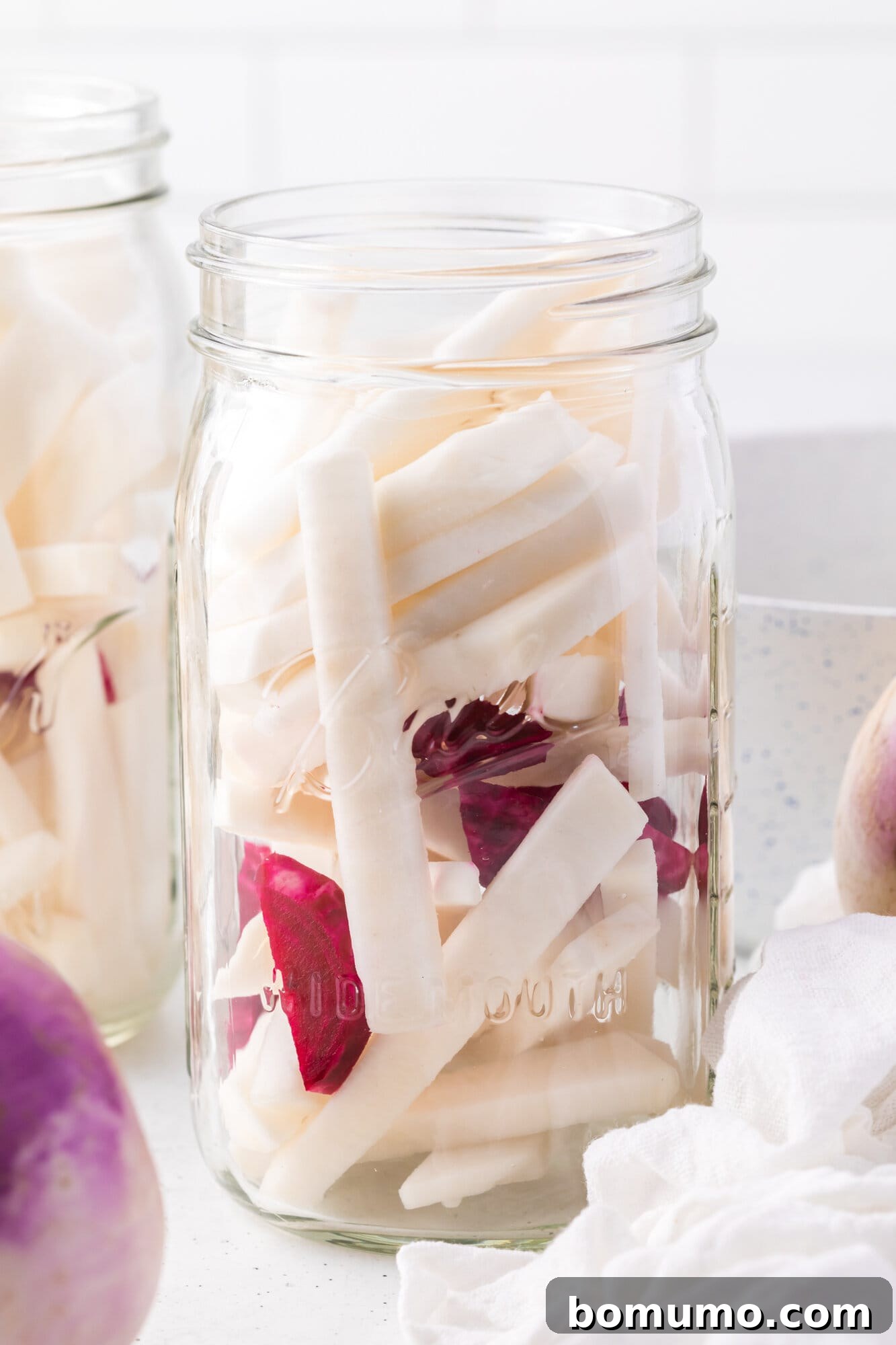 Turnips and beets in a large jar, no brine added yet.