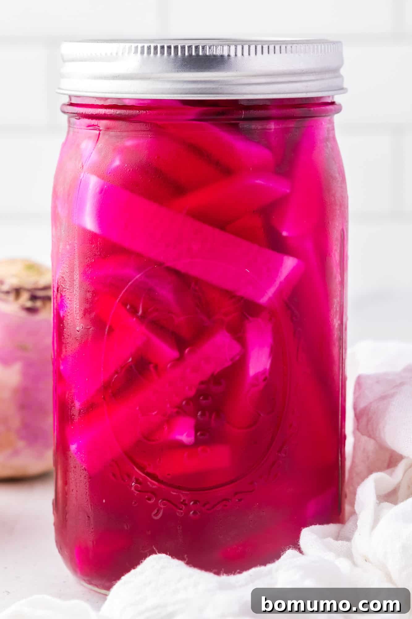 Large mason jar of pickled turnips.