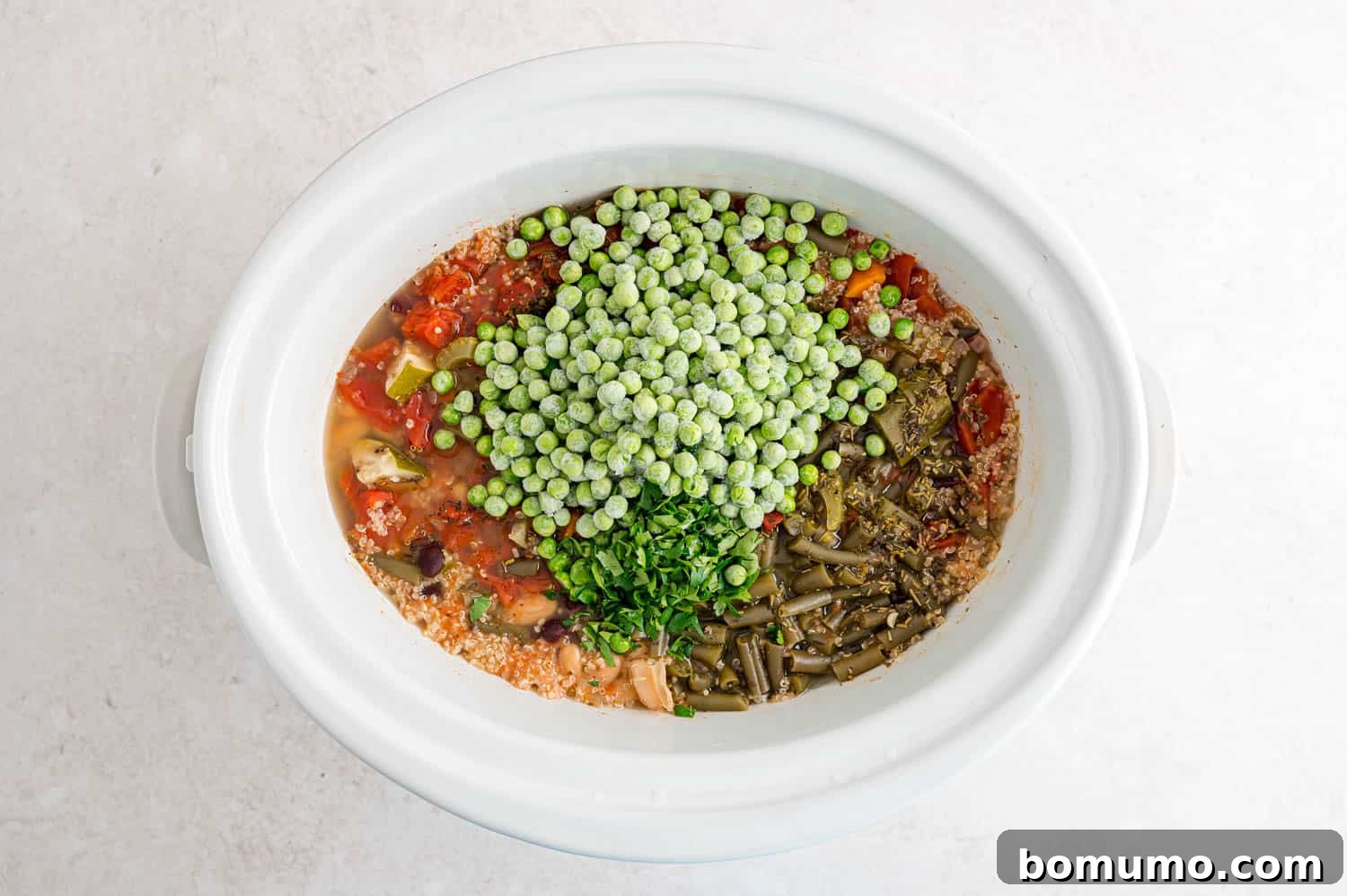 Peas and parsley added to the soup.