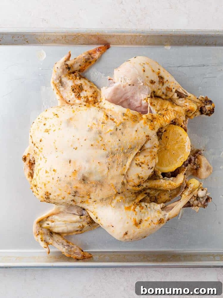 Cooked chicken on a sheet pan.