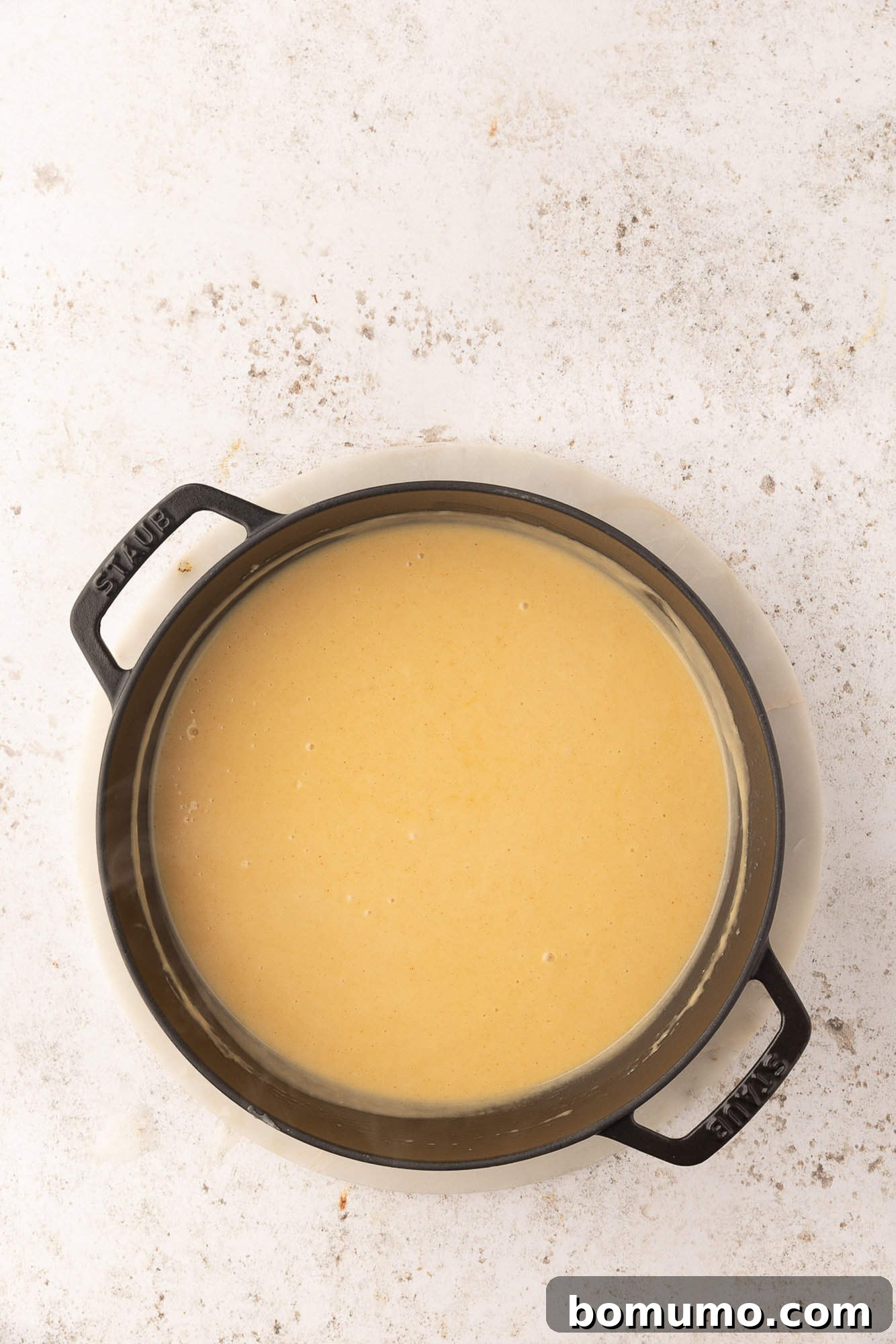 Cheese melted in to form beer cheese sauce.