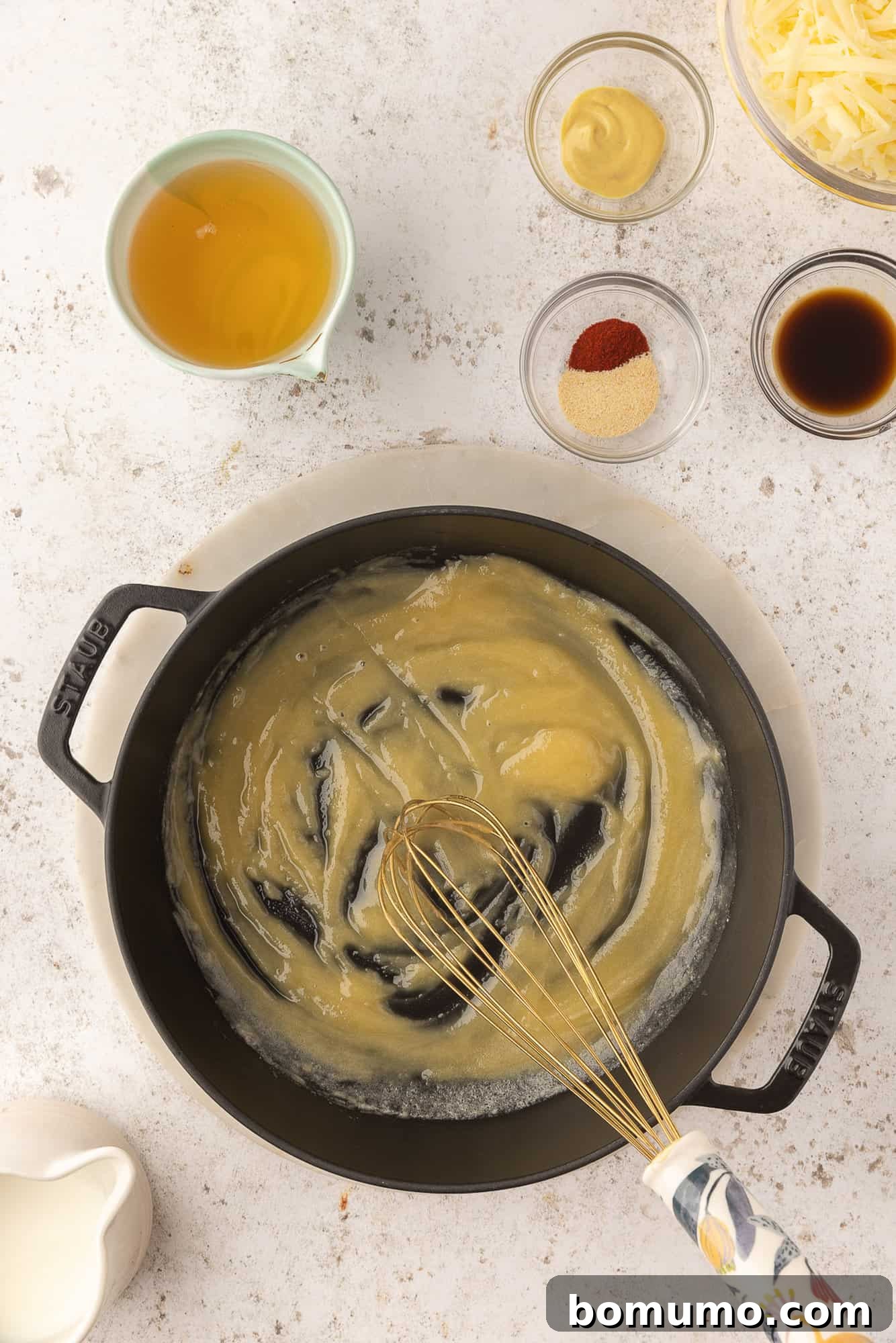 Roux being made with butter and flour.
