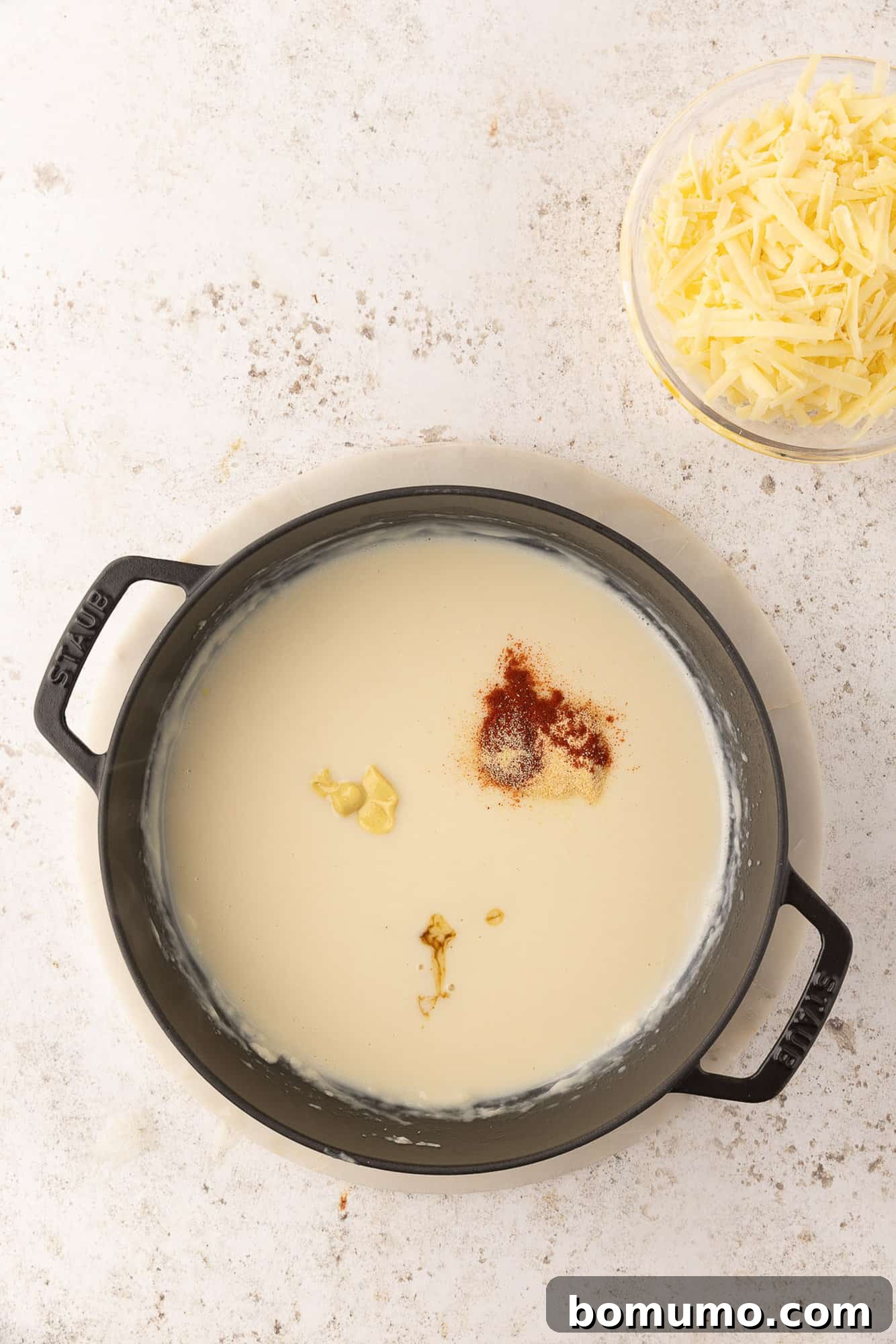 Seasonings added to white sauce.