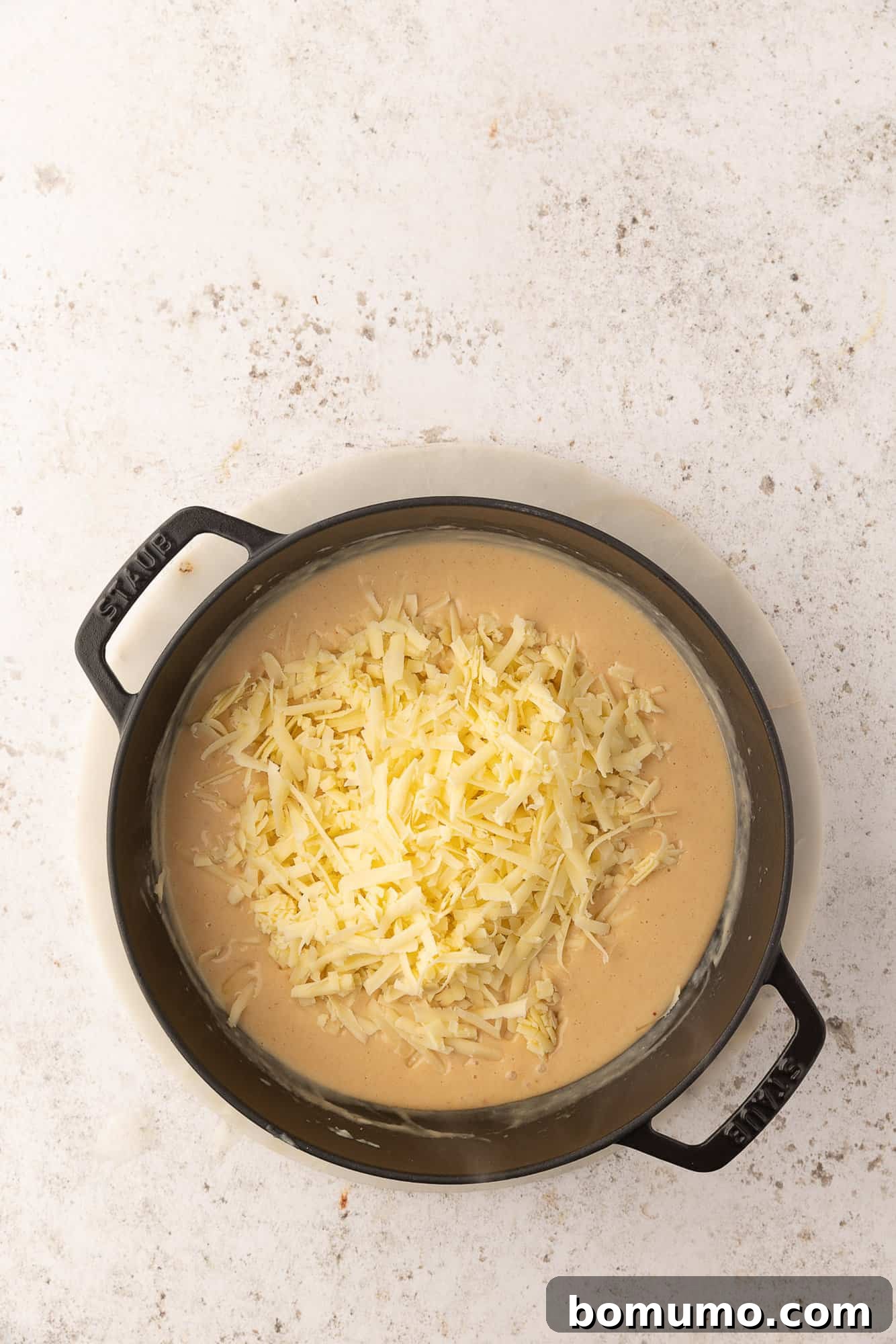 Cheese added, not yet melted in.