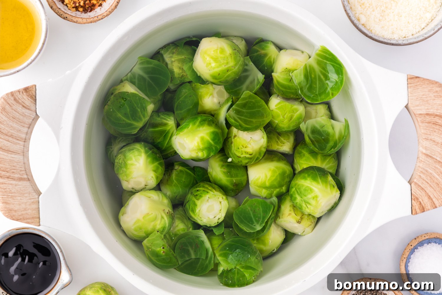 Crispy Roasted Brussels Sprouts 5 Brussels sprouts in boiling water in a pan.