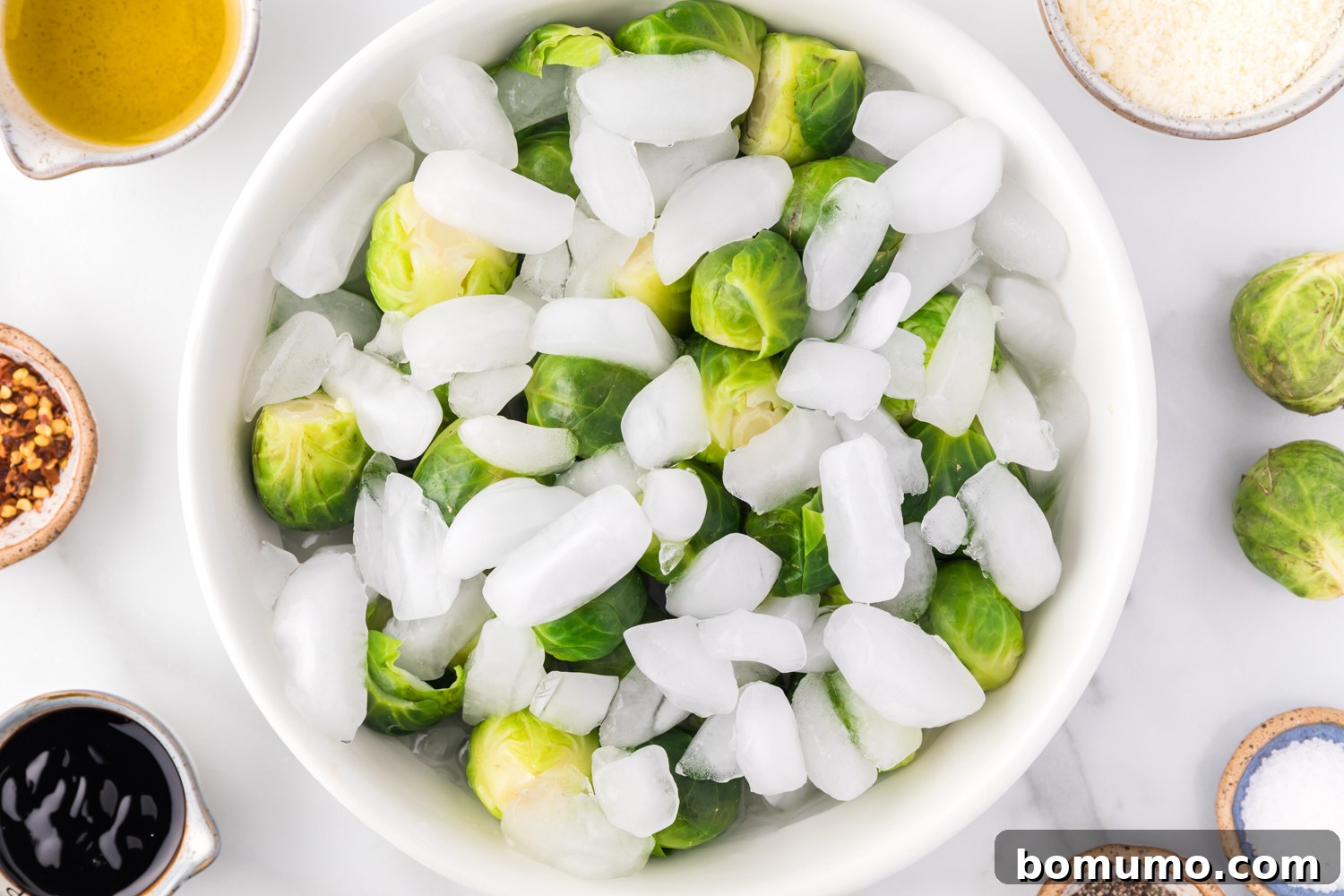 Crispy Roasted Brussels Sprouts 6 Brussels sprouts in an ice water bath.