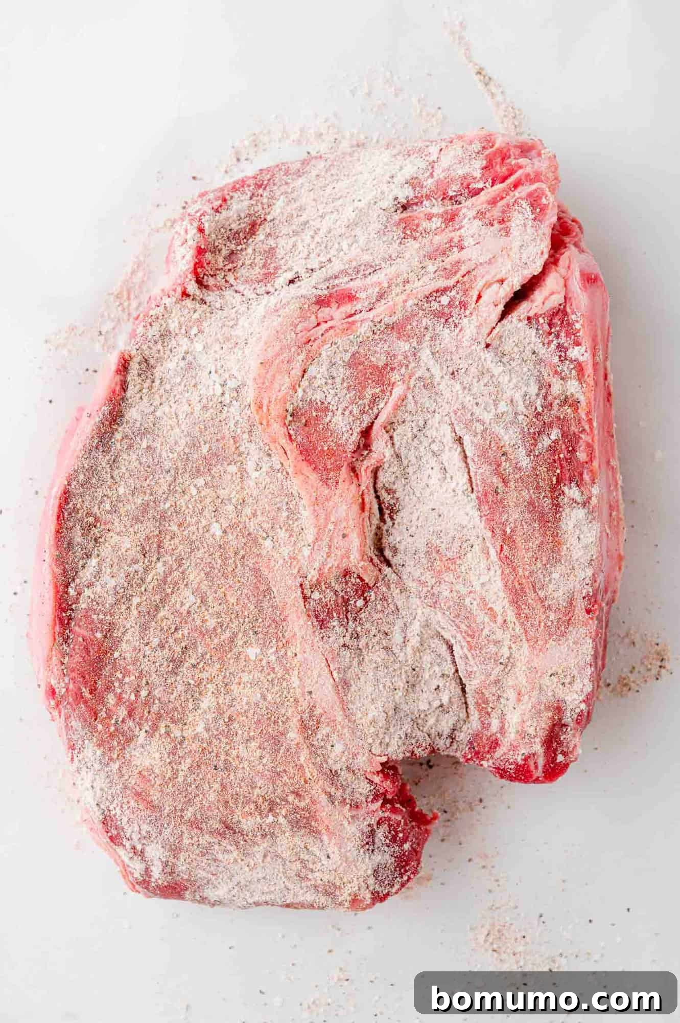Roast coated in seasoning mixture.