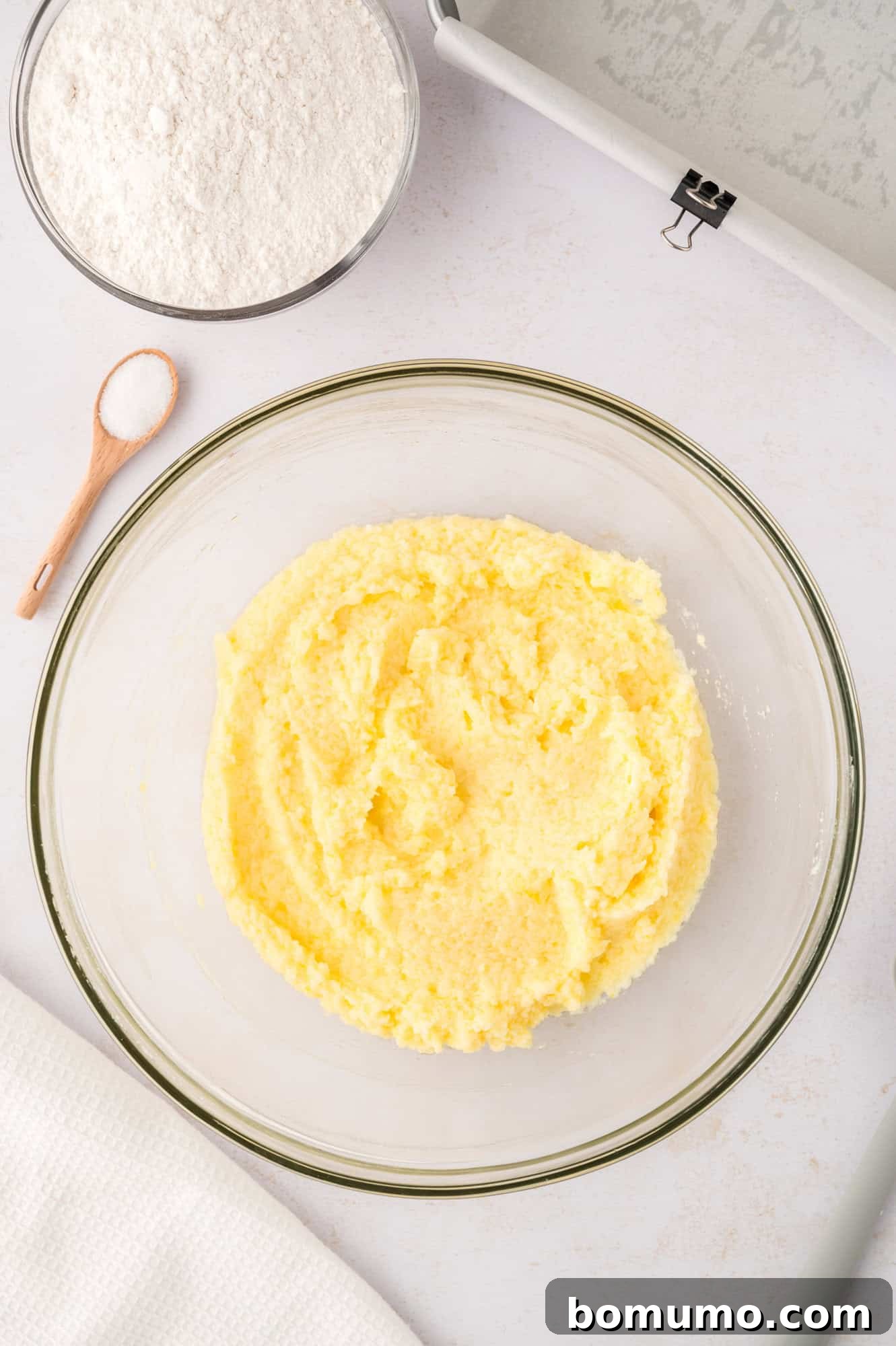 Completed wet ingredients mixture, smooth and lemon-infused, ready for dry ingredients.