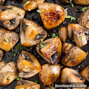 Sautéed mushrooms with marsala close up, sprinkled with fresh herbs, highlighting the rich flavors and tender texture.