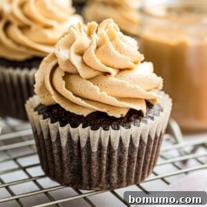 Peanut butter frosting beautifully piped on a chocolate cupcake.