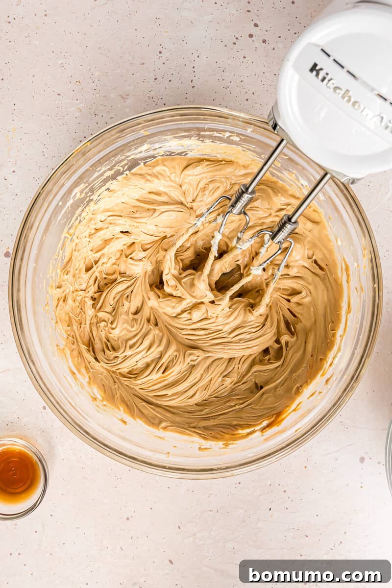 Peanut butter and butter thoroughly mixed together into a smooth, uniform, and harmonious creamy base.