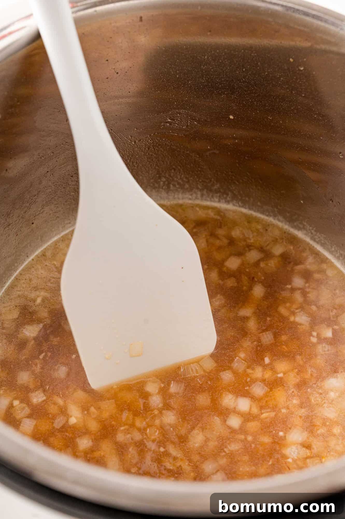 Instant Pot being deglazed.