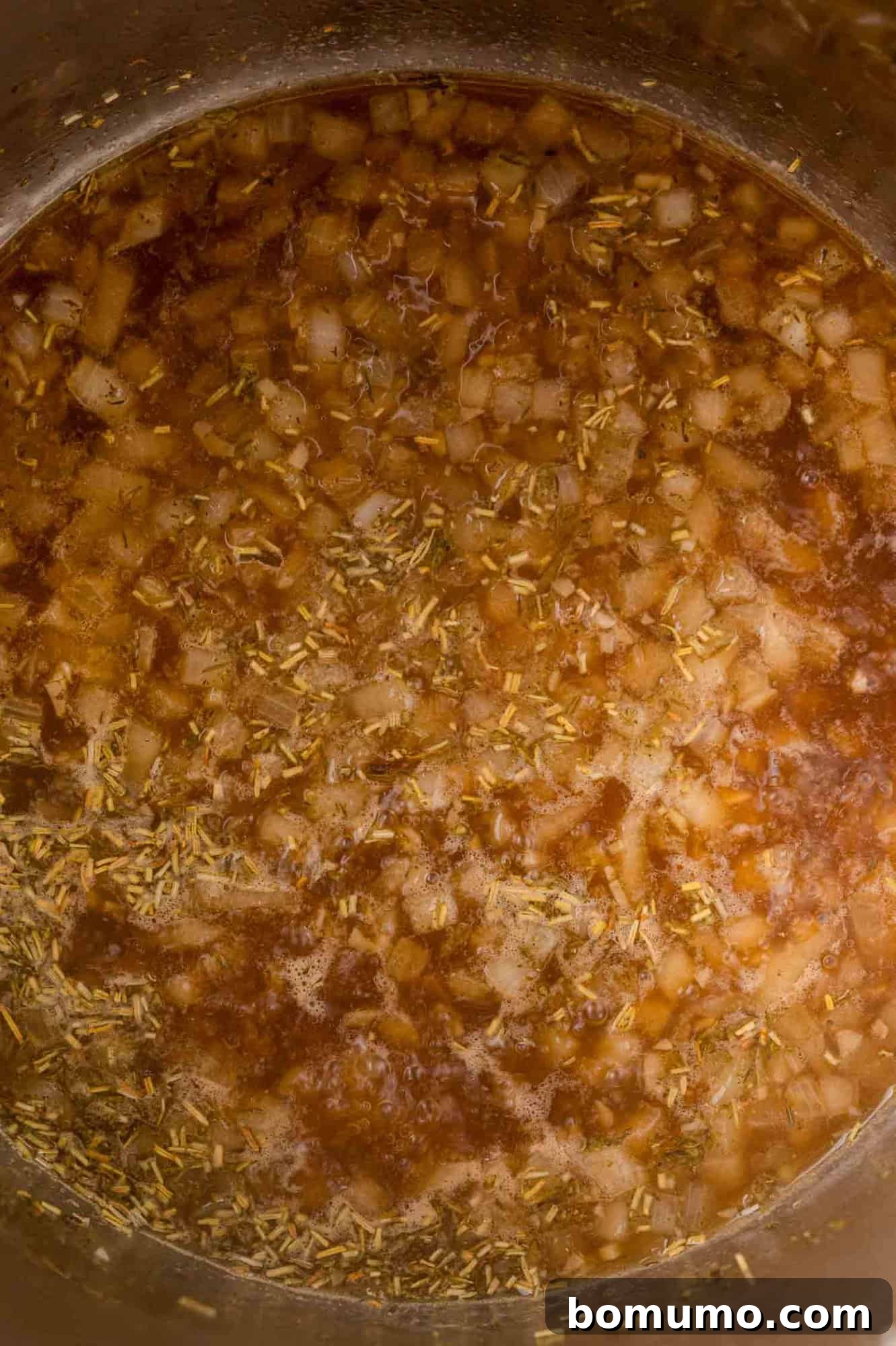Herbs added to onions and broth.
