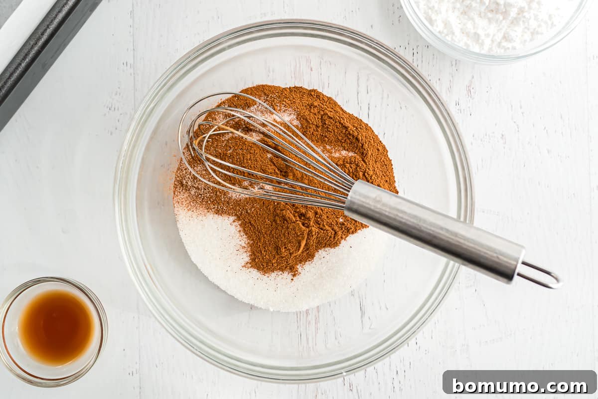 Cinnamon and sugar in a bowl, not yet mixed.
