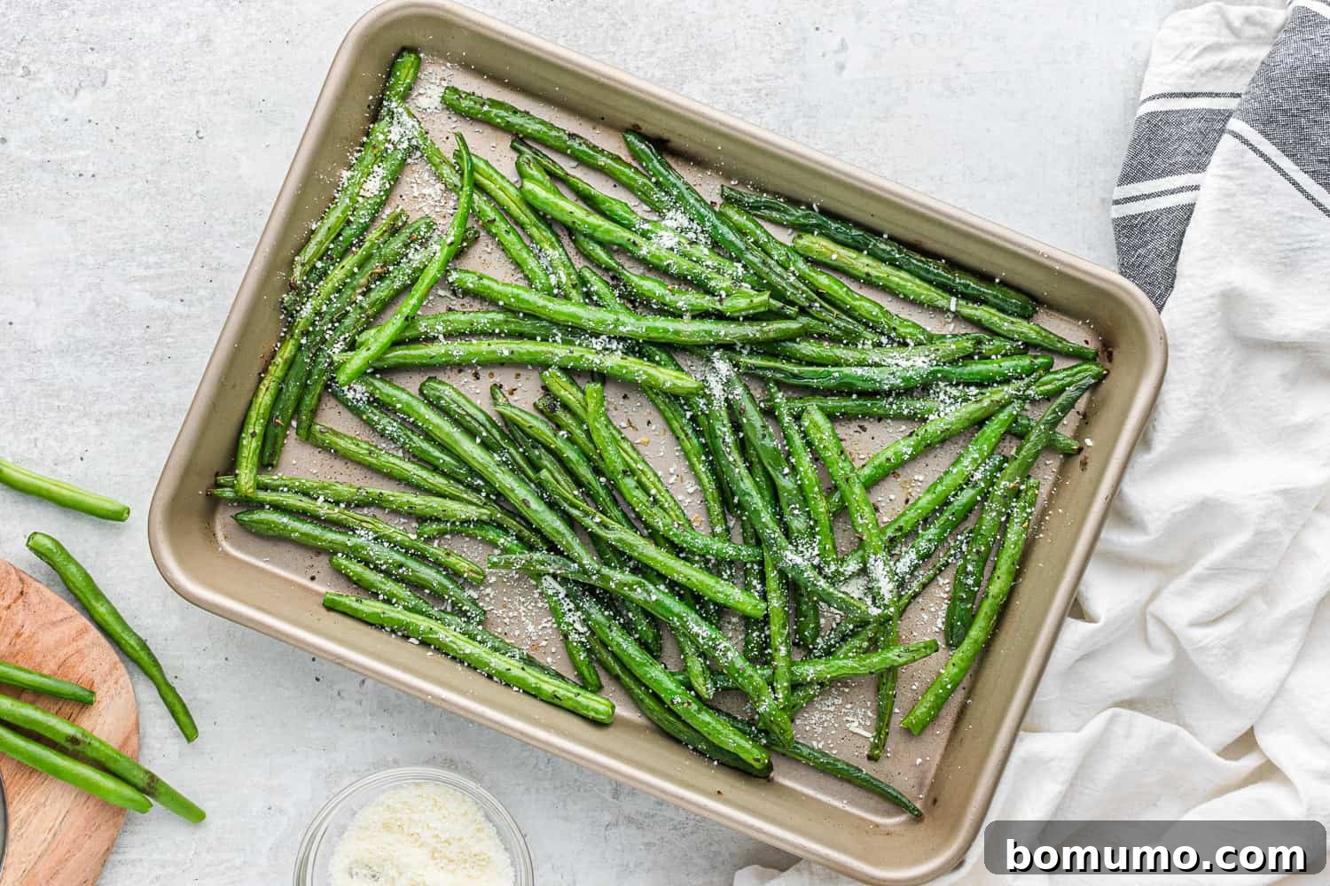 Roasted green beans on a sheet pan.