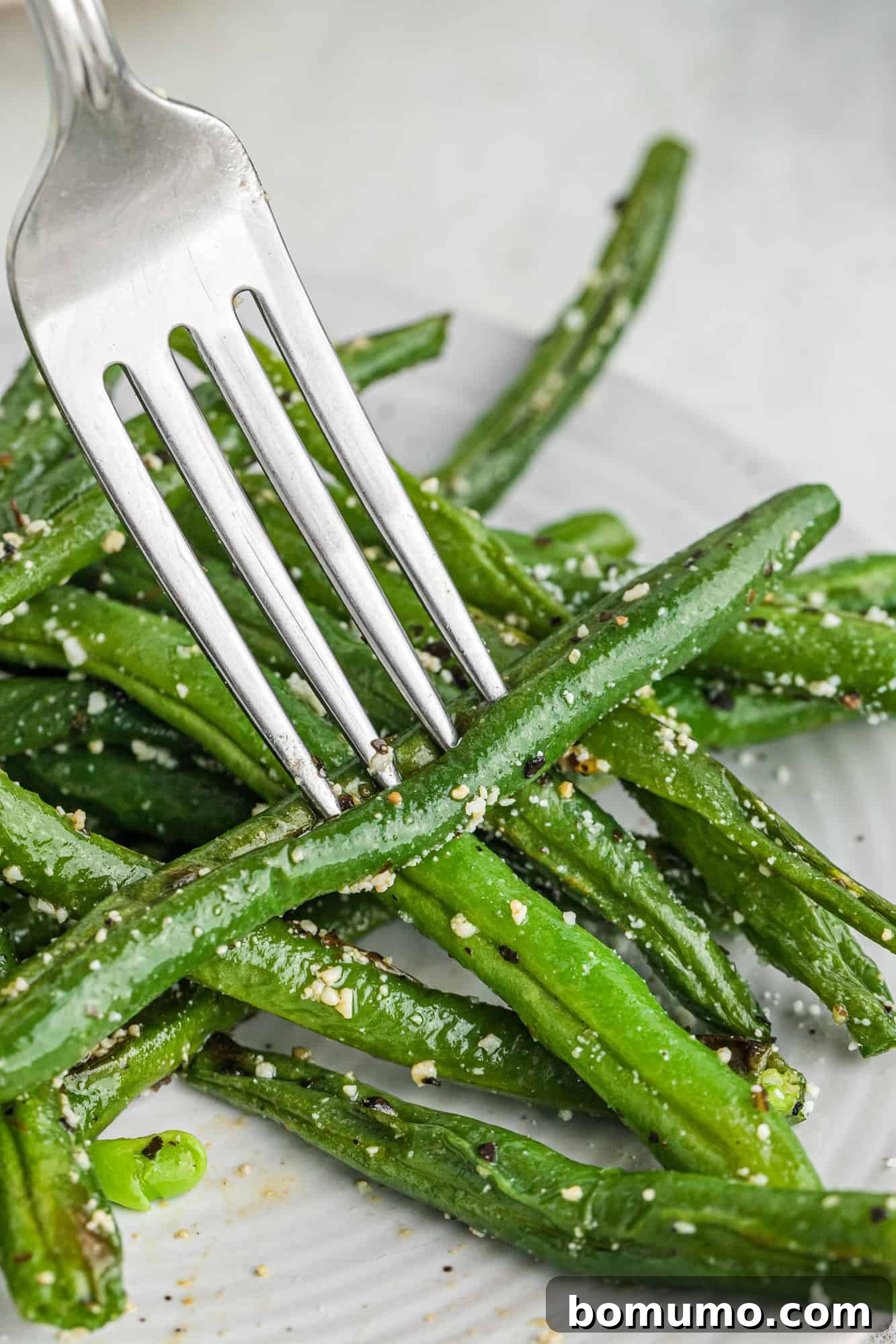 Green bean on a fork.