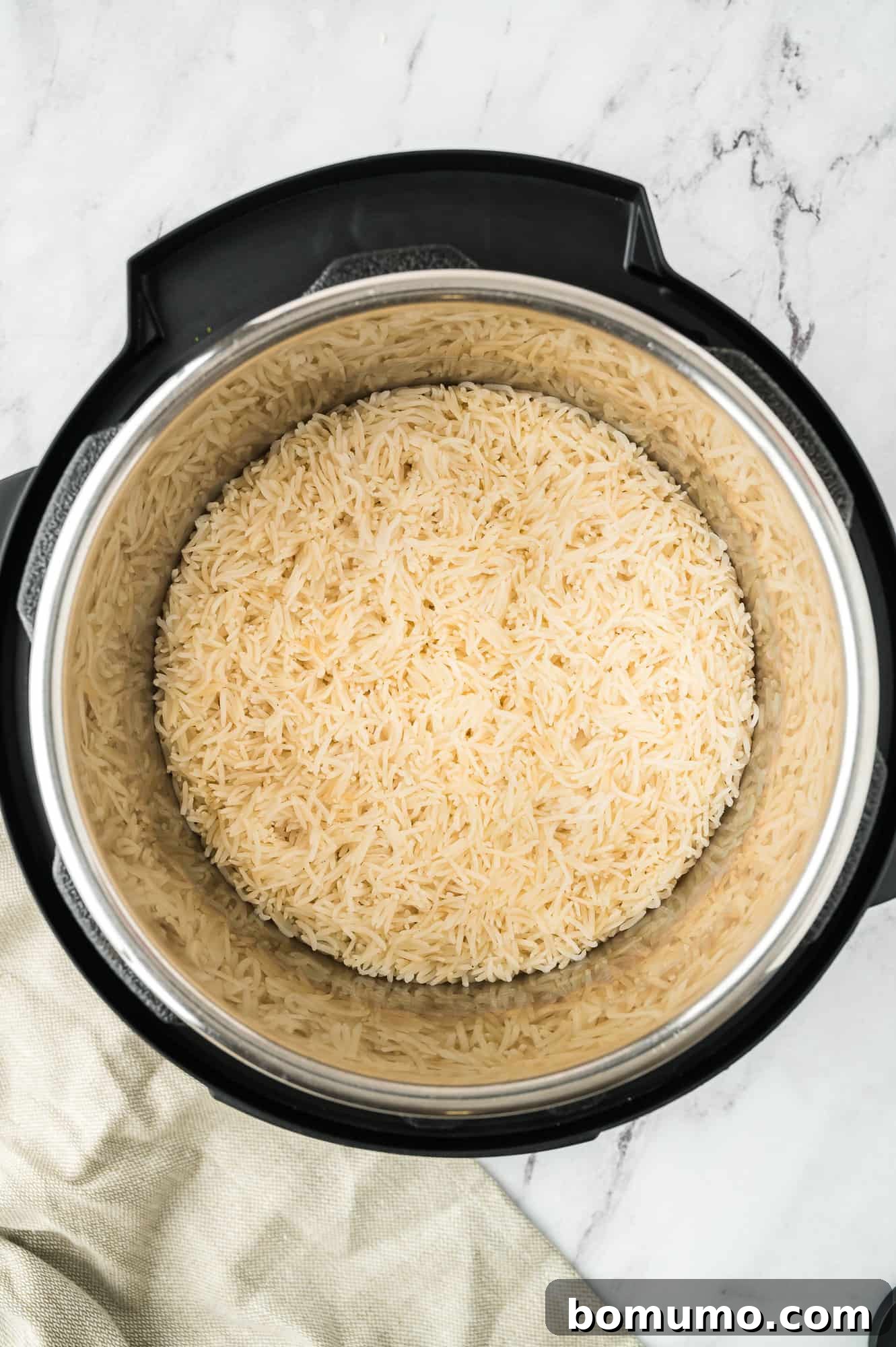 Cooked basmati rice in an Instant Pot after natural release, looking fluffy and ready.