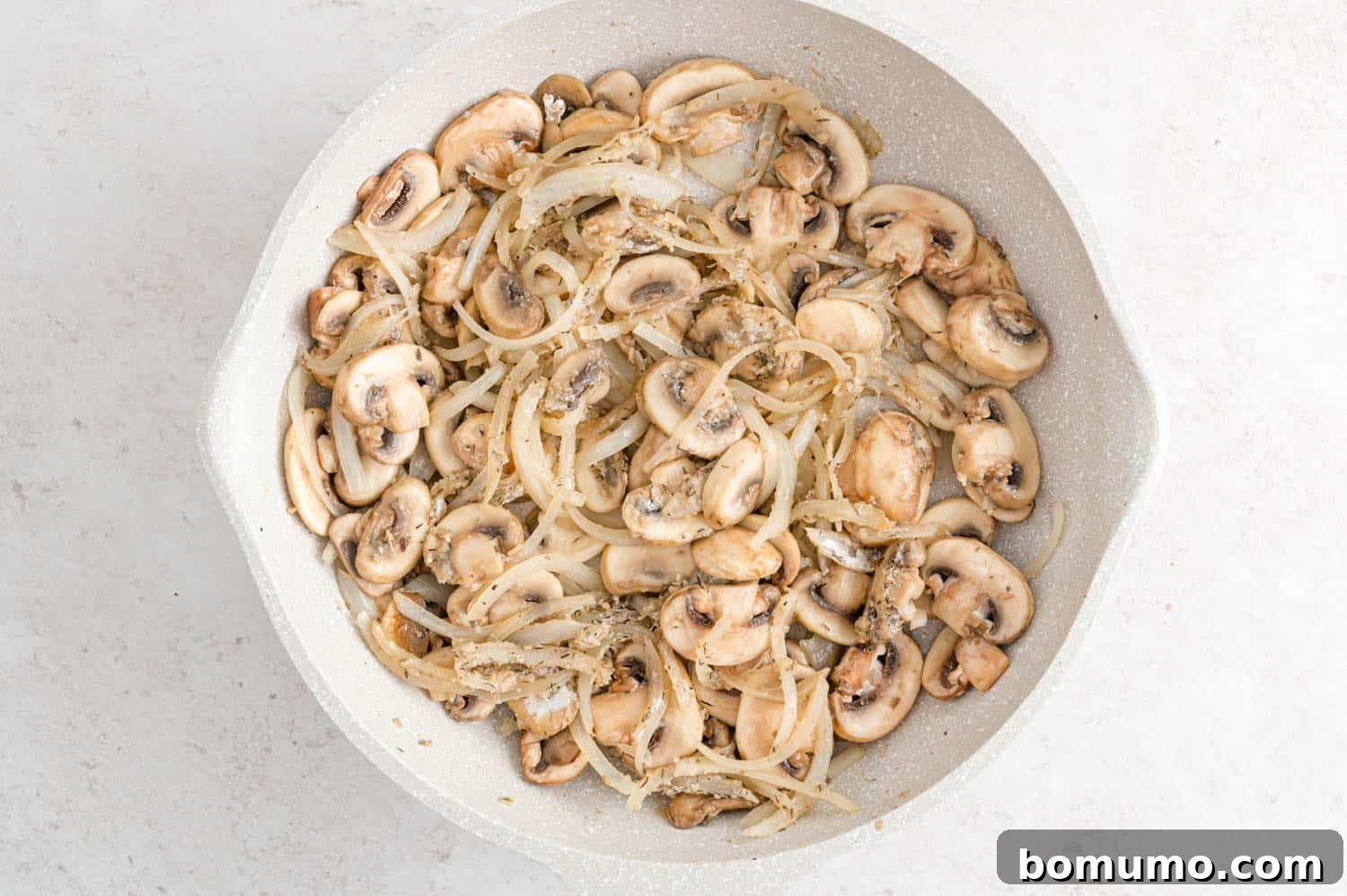 Velvety Chicken Stroganoff 7 Sautéed mushrooms and onions, softened and lightly browned in the pan.