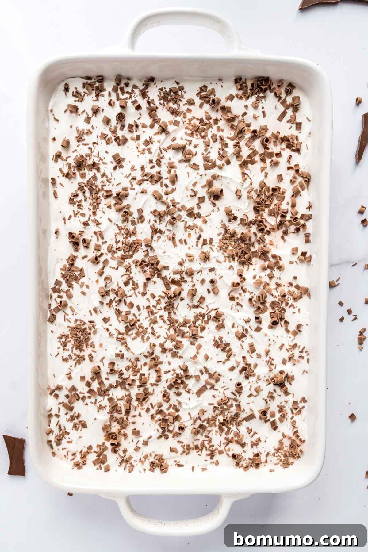 Elegant chocolate shavings sprinkled over the top whipped cream layer of the finished Chocolate Delight dessert.
