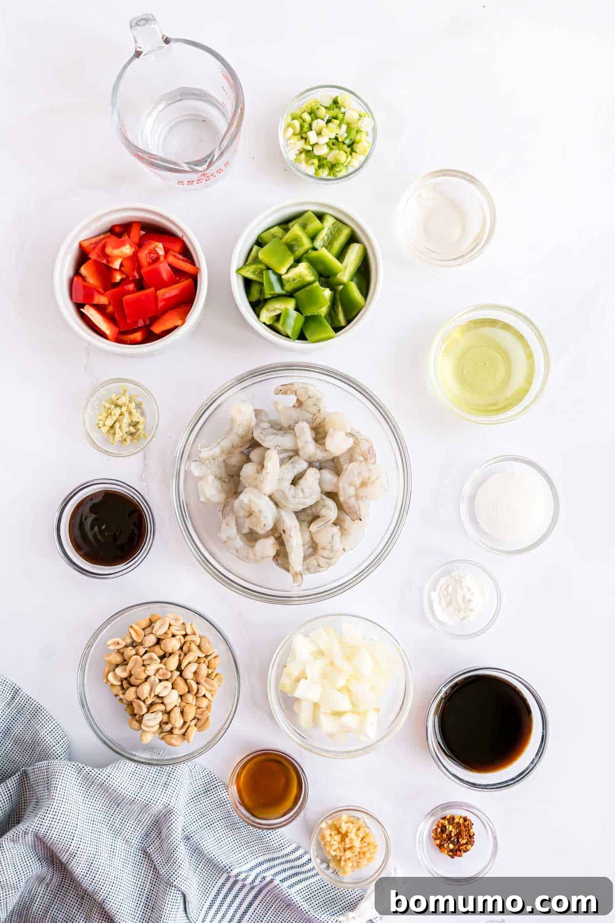 Fiery Peanut Shrimp Delight 4 An overhead shot showcasing all the fresh, colorful ingredients neatly arranged and ready for making Kung Pao Shrimp.