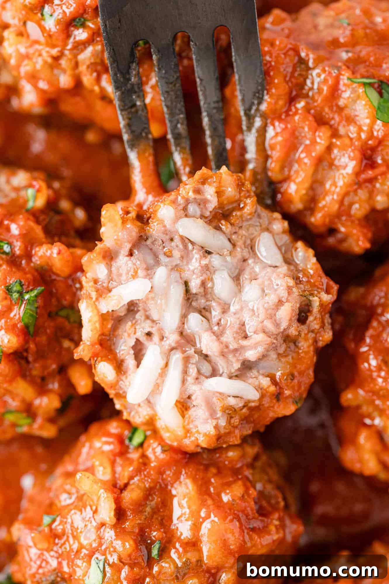 Rice-Studded Meatballs 3 Porcupine meatball cut open to show filling.