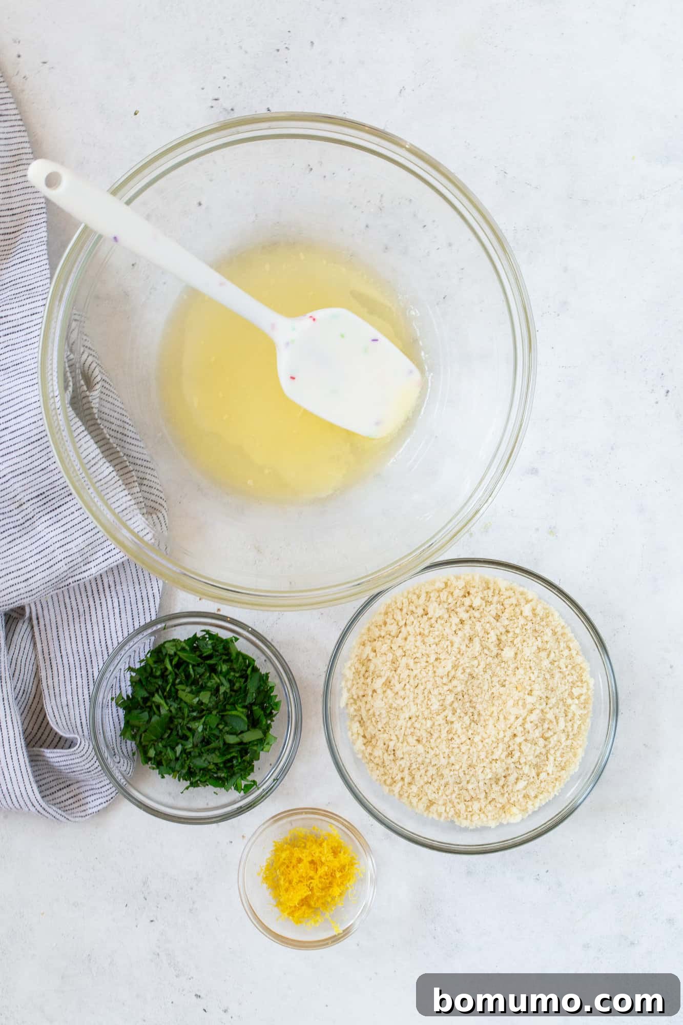 Creamy Asparagus Bake 13 Individual ingredients for the breadcrumb topping: panko, fresh parsley, and lemon zest.