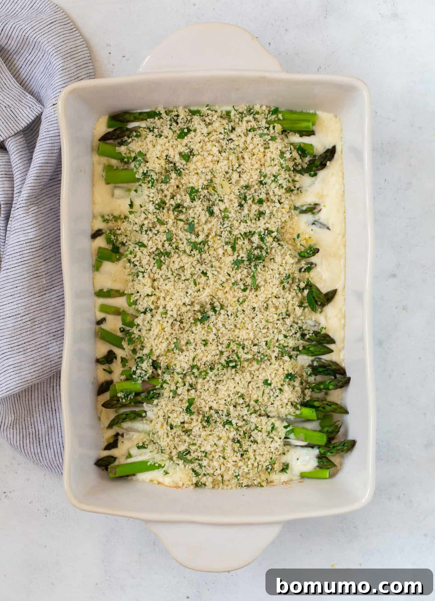 Creamy Asparagus Bake 16 Breadcrumb topping sprinkled over the creamy asparagus casserole, before its final bake.