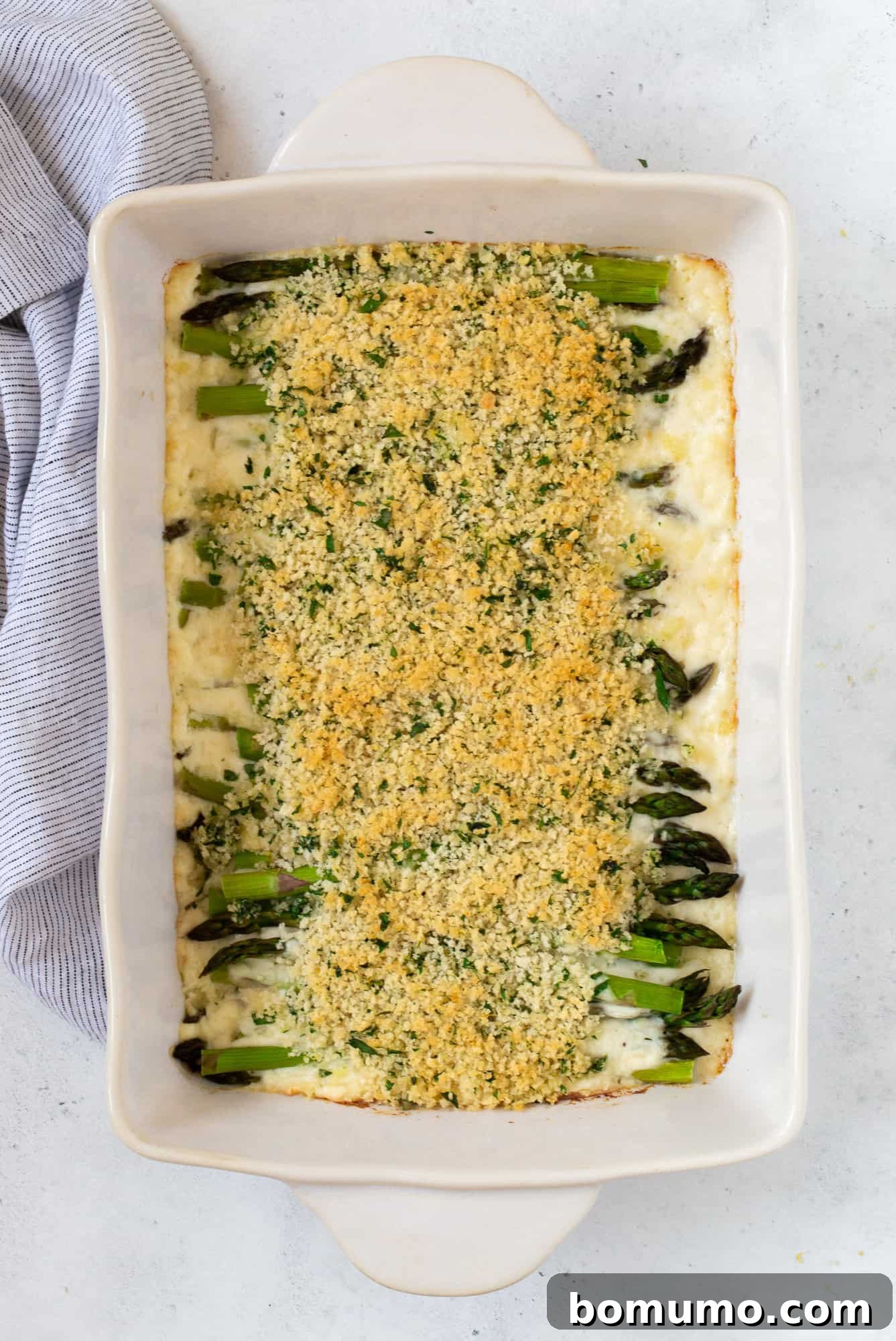 Creamy Asparagus Bake 17 Finished asparagus casserole, golden brown and bubbly, with perfectly toasted breadcrumbs on top.