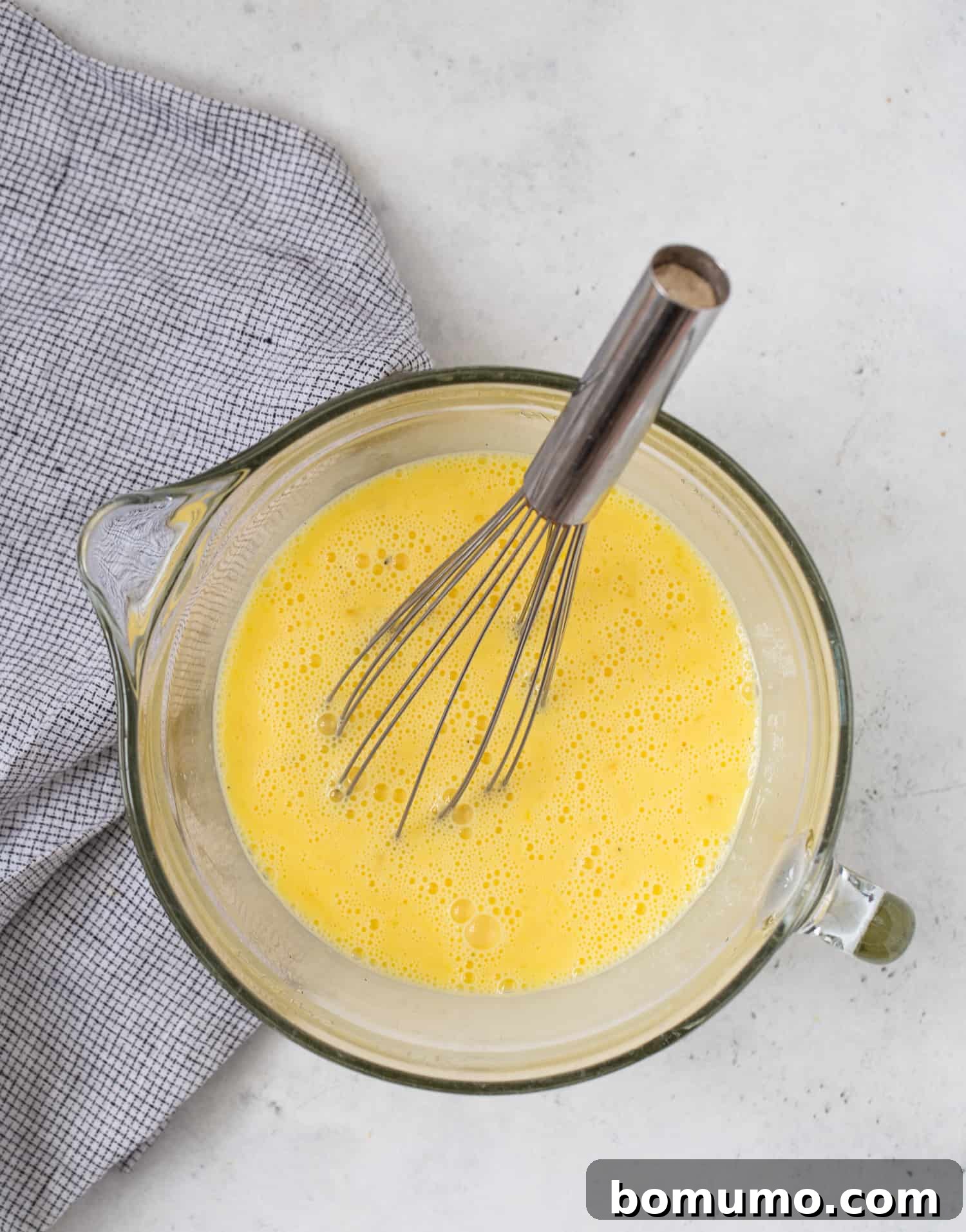Eggs and seasonings scrambled together.