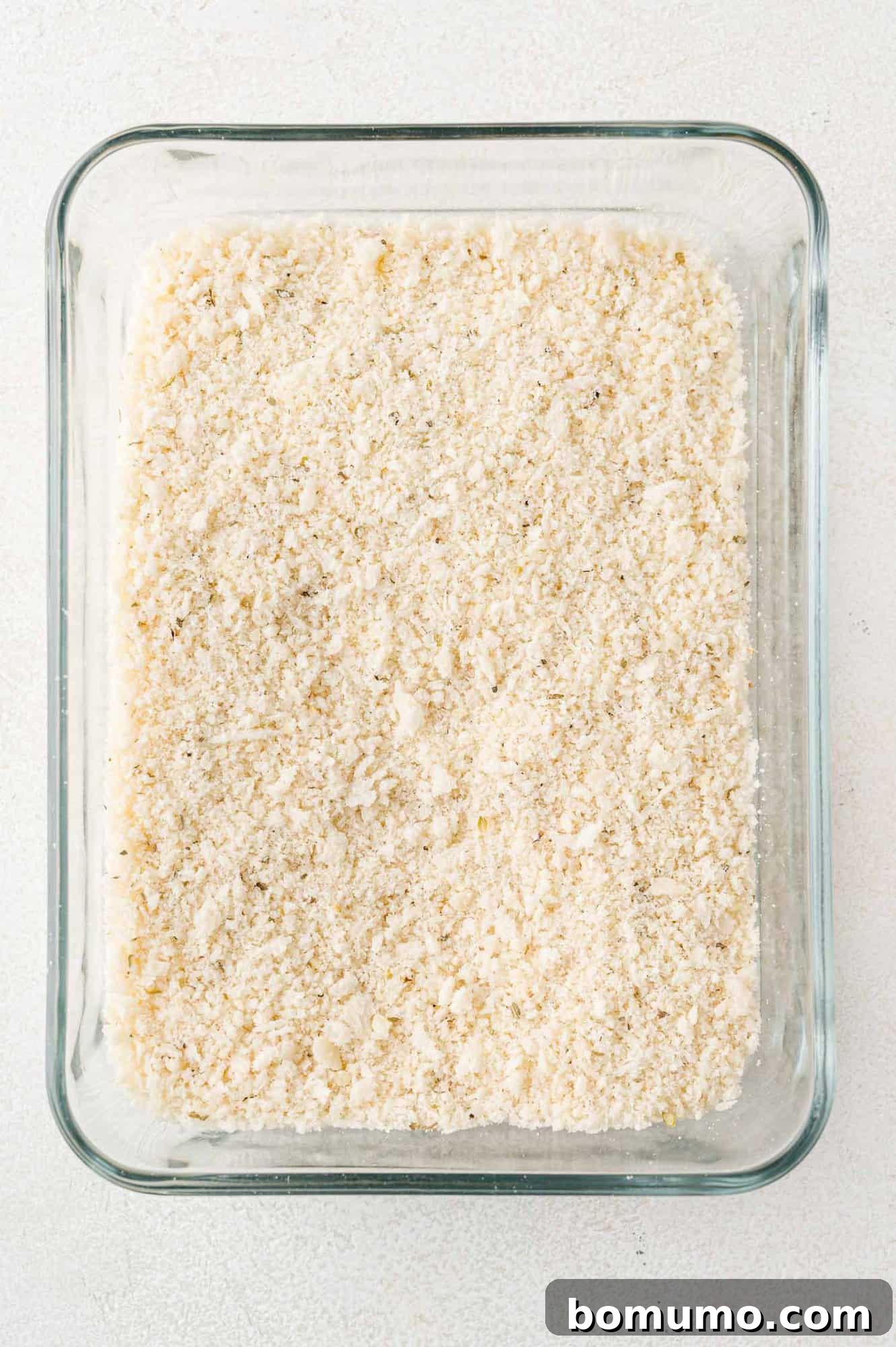 Crispy Air Fried Eggplant 7 Panko bread crumbs in a square baking dish.