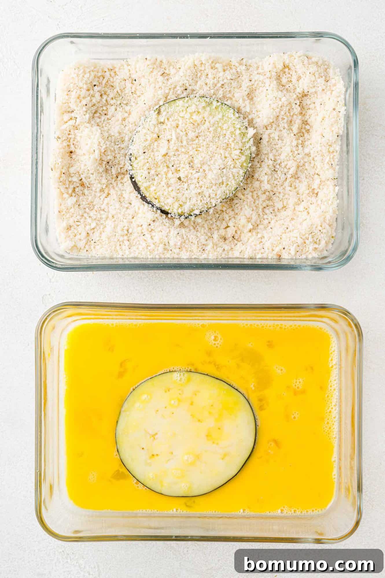 Crispy Air Fried Eggplant 9 One eggplant slice in panko dish, one eggplant slice in beaten egg dish.
