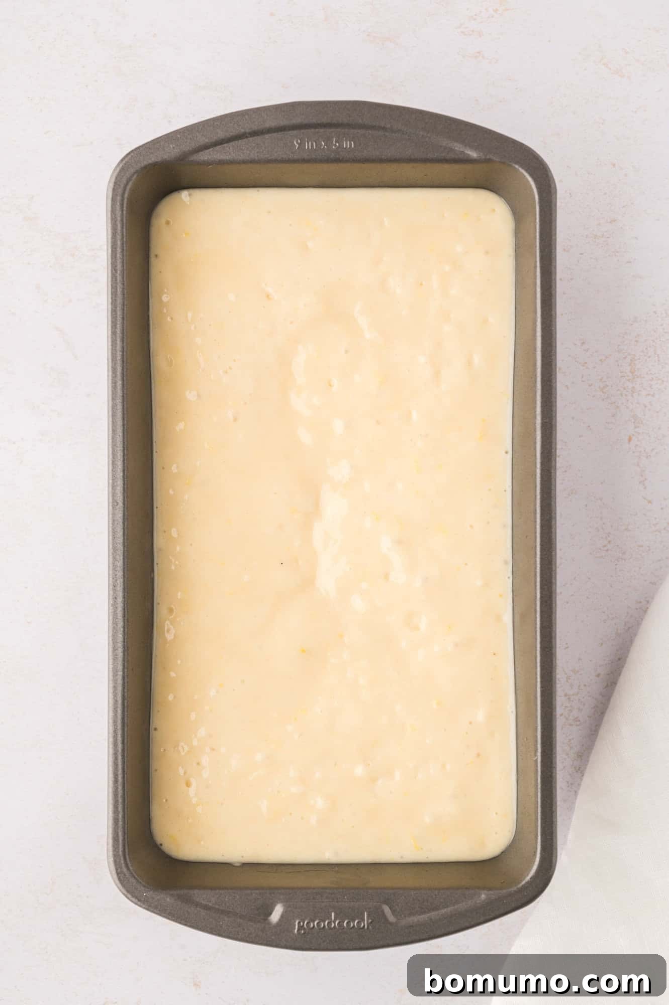 Unbaked bread in a loaf pan.