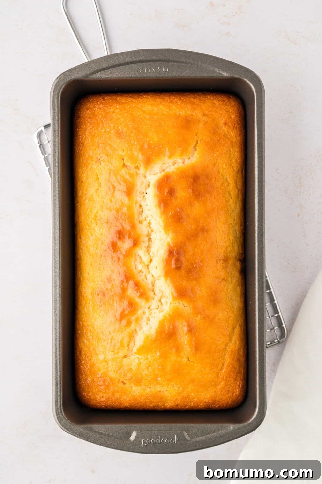 Baked bread in a loaf pan.