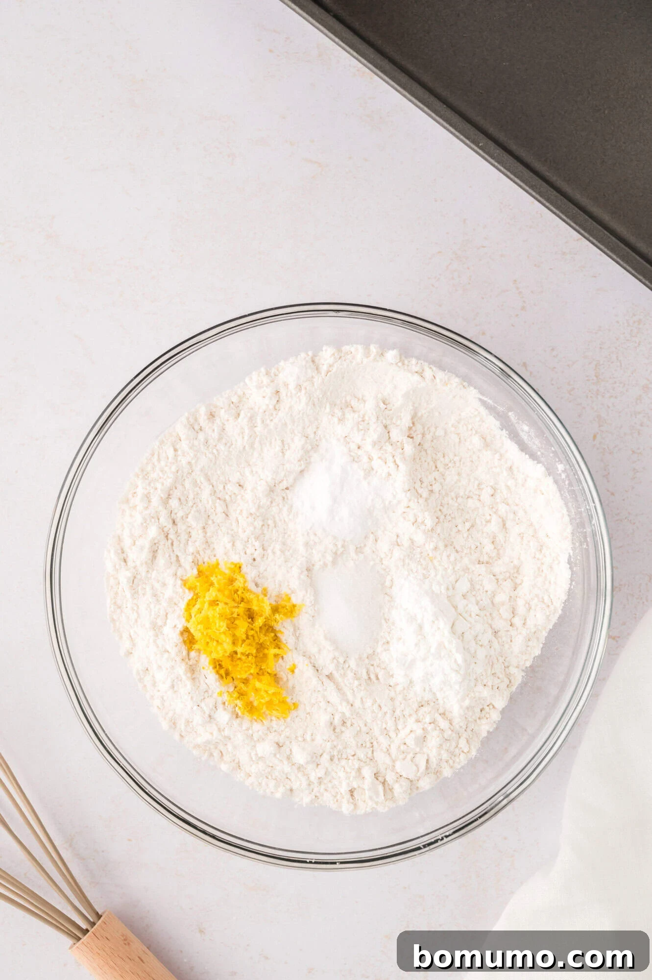 Dry ingredients in a glass bowl, not yet mixed.
