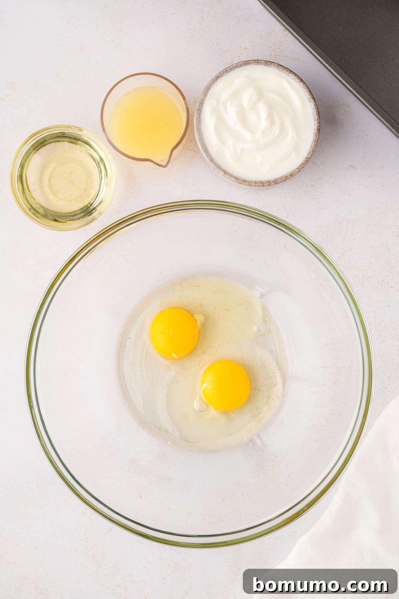 Two eggs in a glass bowl.