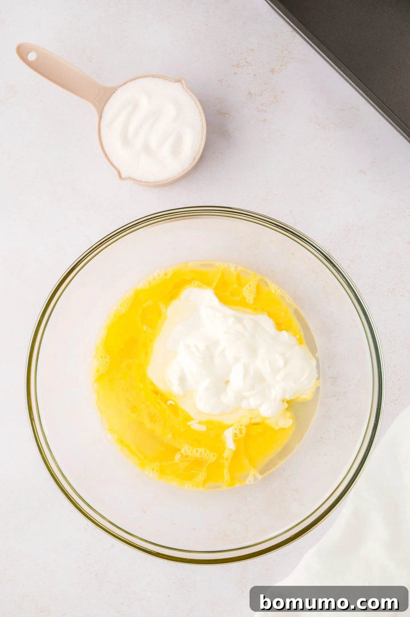 Yogurt added to beaten eggs.