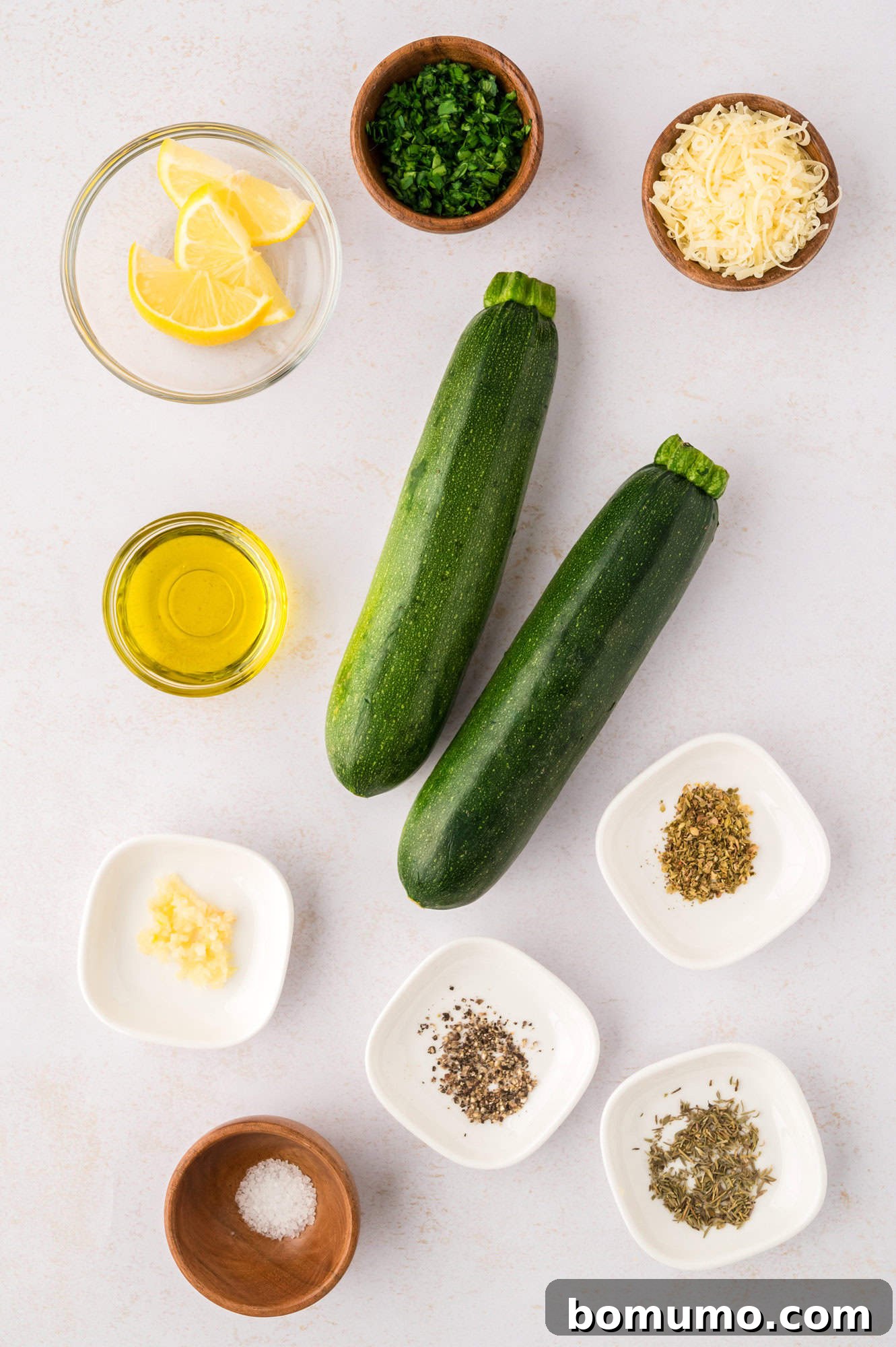 Essential ingredients for this delicious sautéed zucchini recipe, including two fresh medium zucchini.