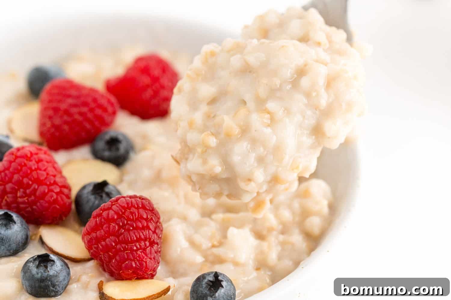 A close-up view revealing the rich, creamy texture of slow-cooked oatmeal, inviting and wholesome.