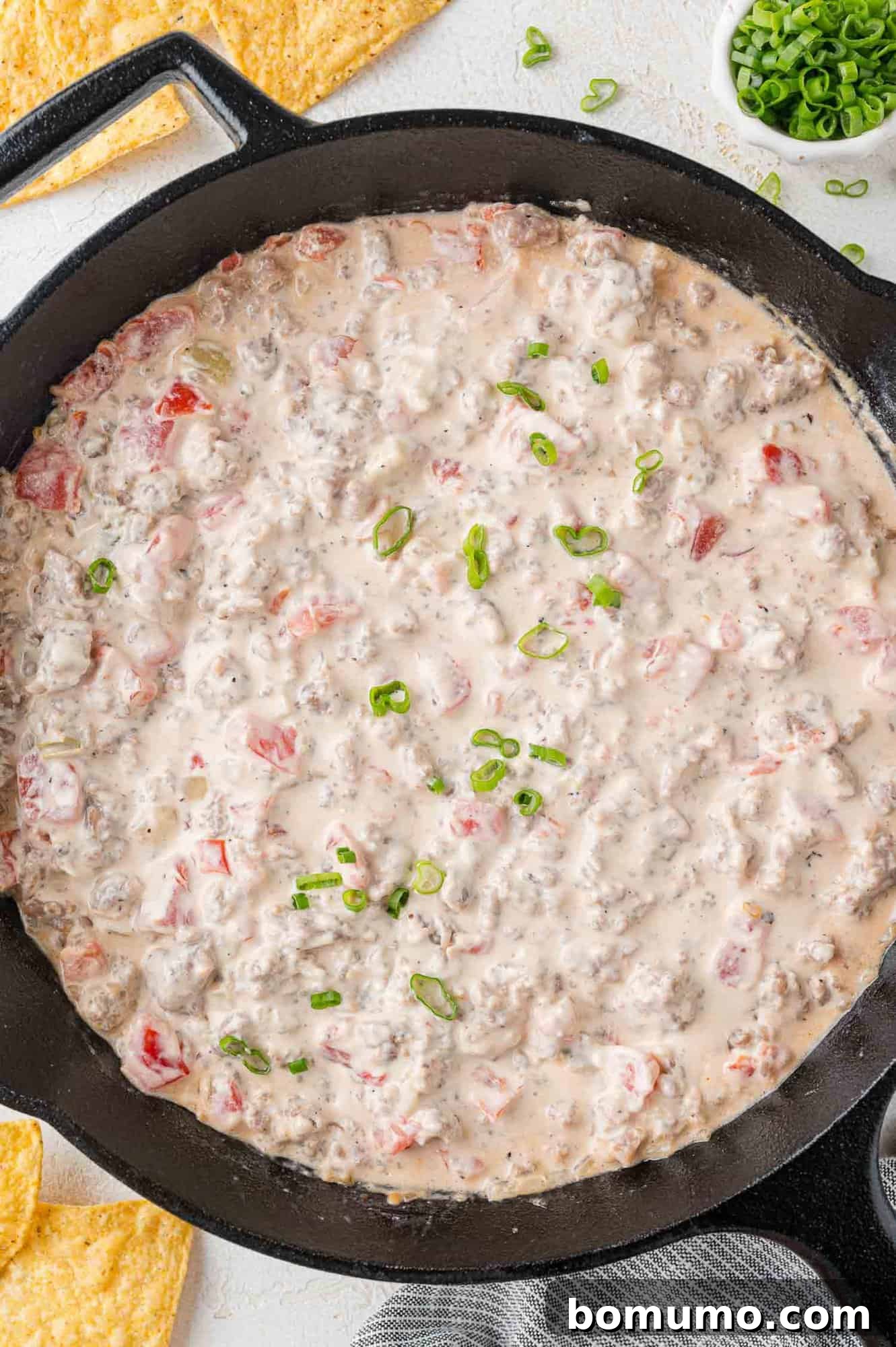 Sausage Cheese Bliss 7 Finished dip in a black skillet.