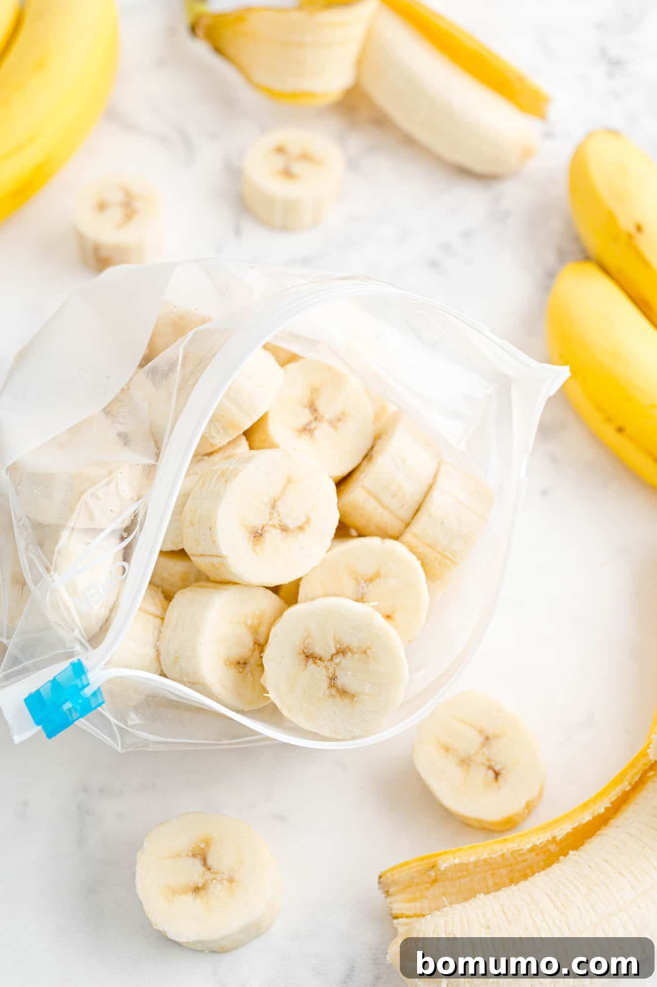 Frozen bananas in a freezer bag, neatly arranged for storage.