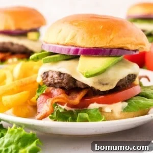 California burger on a brioche bun with toppings - avocado, tomato, bacon and more.